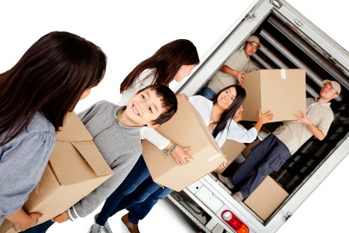 Removal team loading household items in a London street