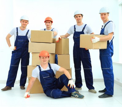 Removal team loading boxes for a London home move