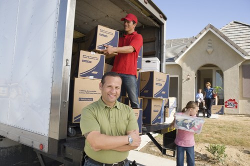 Professional movers loading household items in London