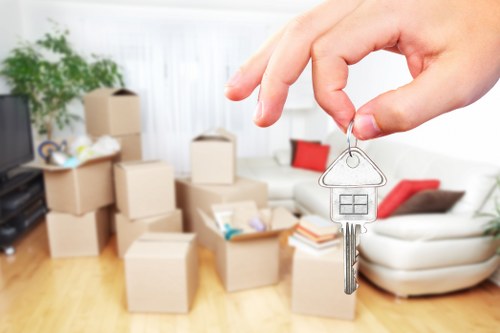 Careful unloading of household items at a London property