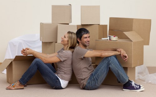 London flat move showing stair access and packed boxes
