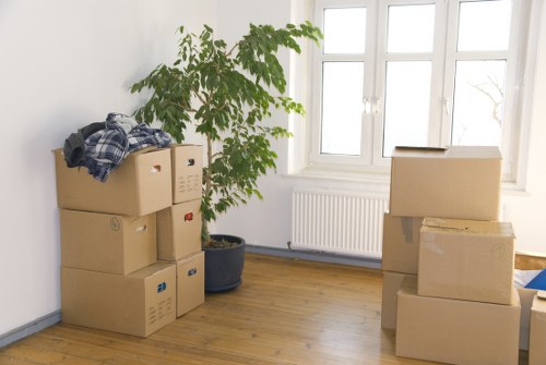 Moving crew handling furniture in a London residential property