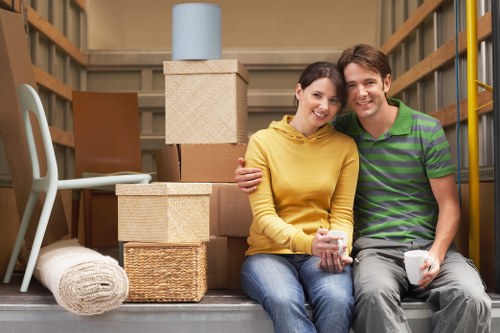 Moving team managing office furniture in a busy London street