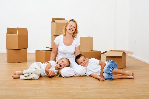 Local moving van service handling boxes near London flats