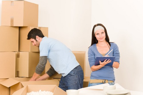London removals team handling boxes and furniture
