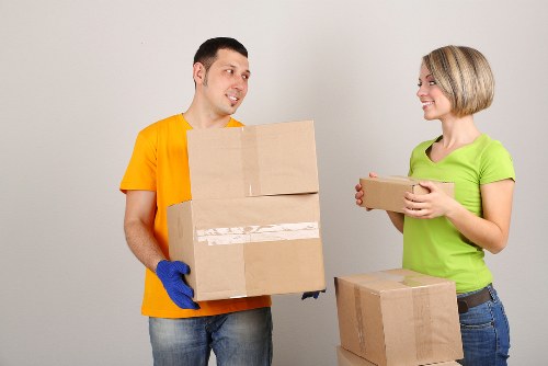 Team helping with boxes and household items for a city relocation