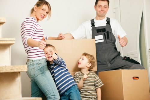 Professional moving team preparing furniture for transport